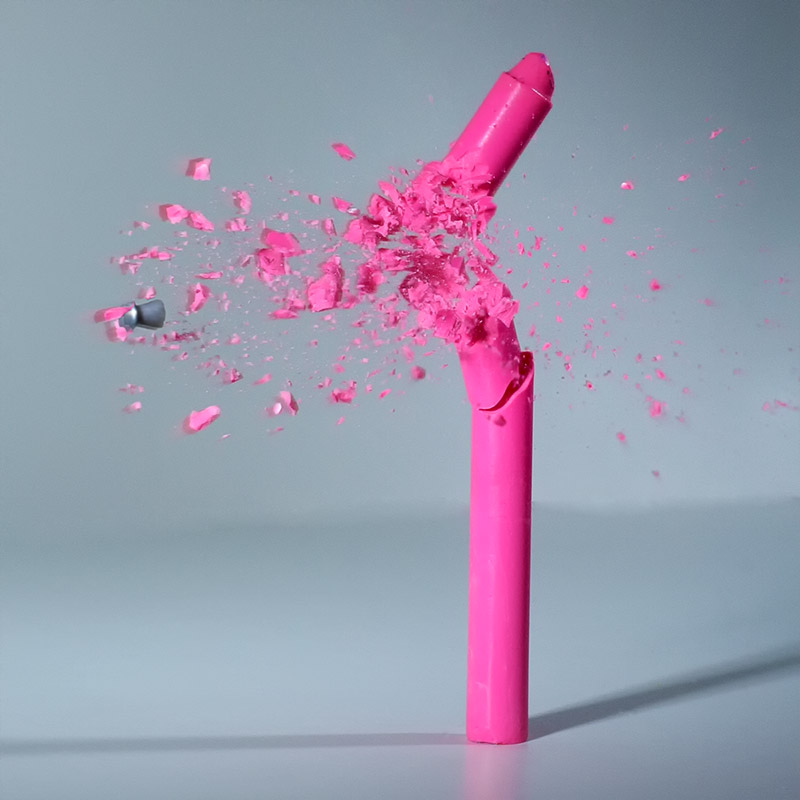 A pink crayon shot by a pellet.